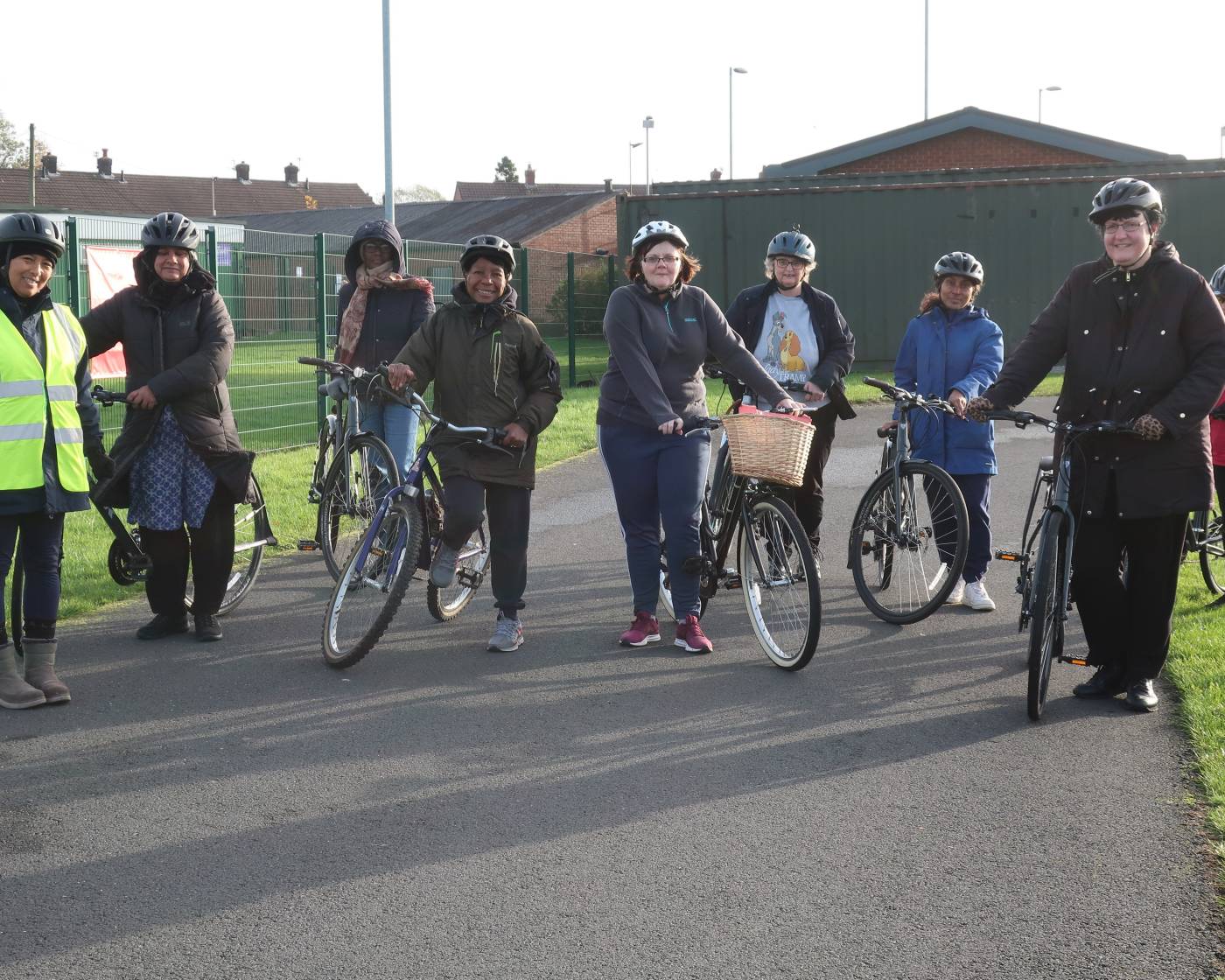Tameside Womens Community Cycling Group stood with their bikes