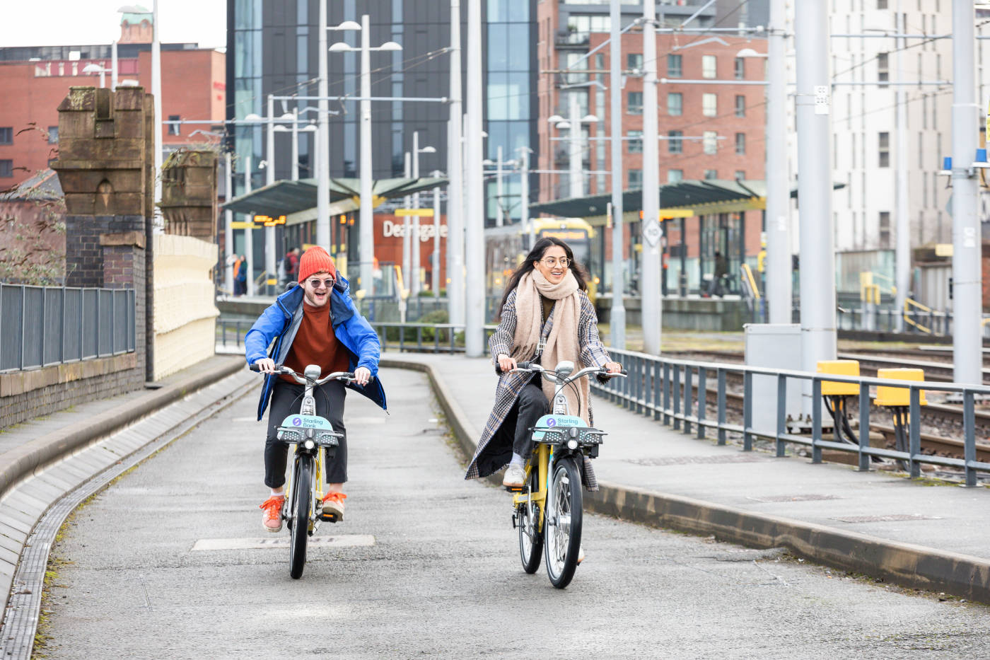 Two cyclists using starling bank bike hire in Manchester