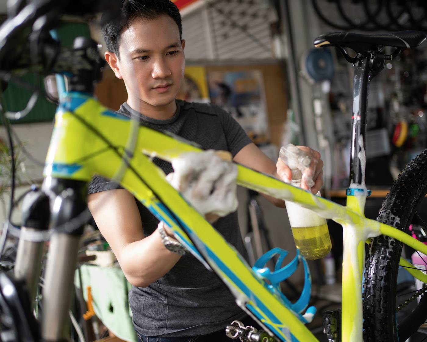 Man wiping down shiny new bicycle