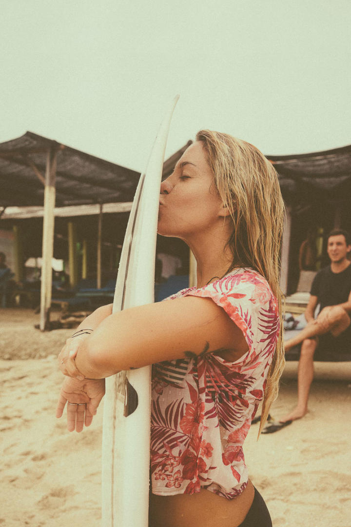 surfer girl with board