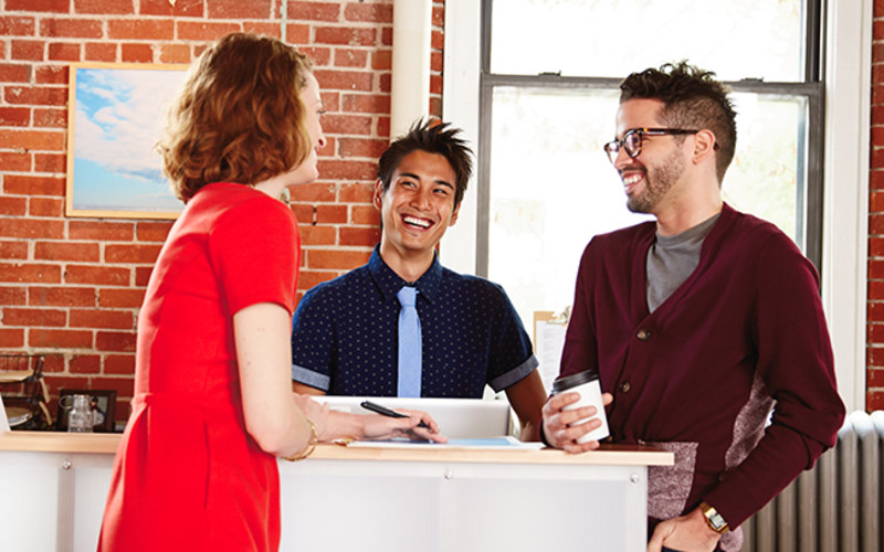 L 3 coworkers laughing stand up meeting