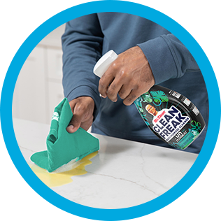 A person cleaning a kitchen countertop with CleanFreak Unstopables