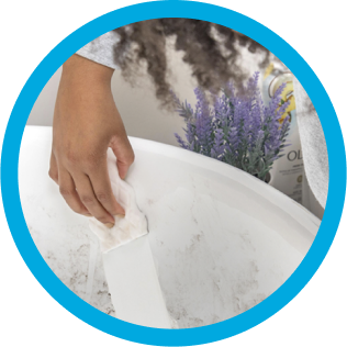 Mr. Clean wipe cleaning a dirty bathtub