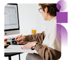Real estate agent at computer working on report