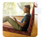 Social media manager sitting with laptop