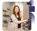 Cafe business owner at coffee machine counter