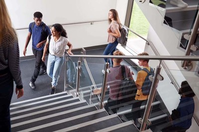 Students walking up school stairs