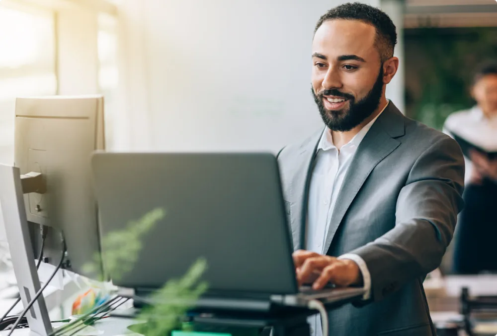 man working in finance on computer