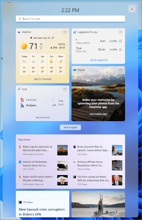 Windows 11 widgets panel showing weather, stock updates, MLB scores, photos, and top news headlines.