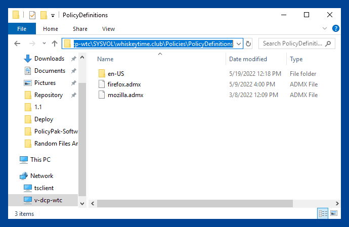 File Explorer window showing the PolicyDefinitions folder with firefox.admx and mozilla.admx files.