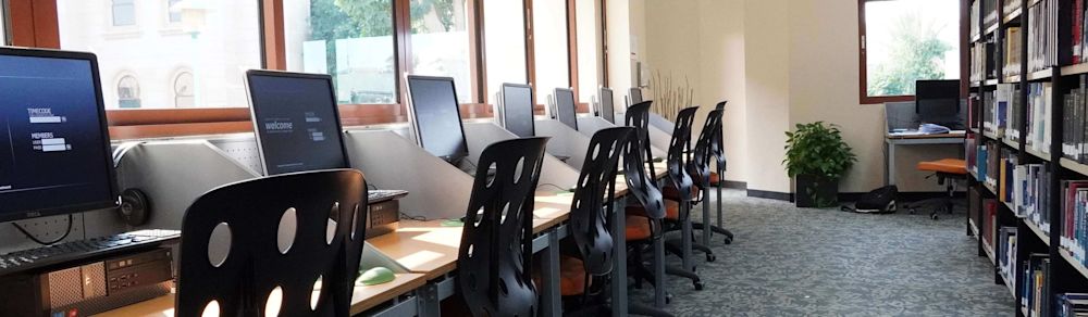 School library computer lab with a row of PCs