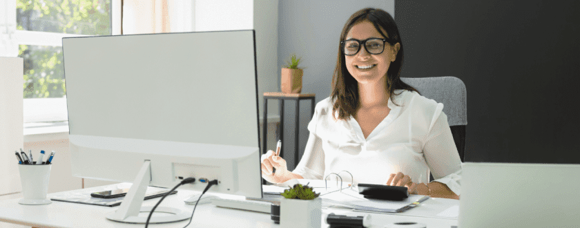 Woman in office using computer