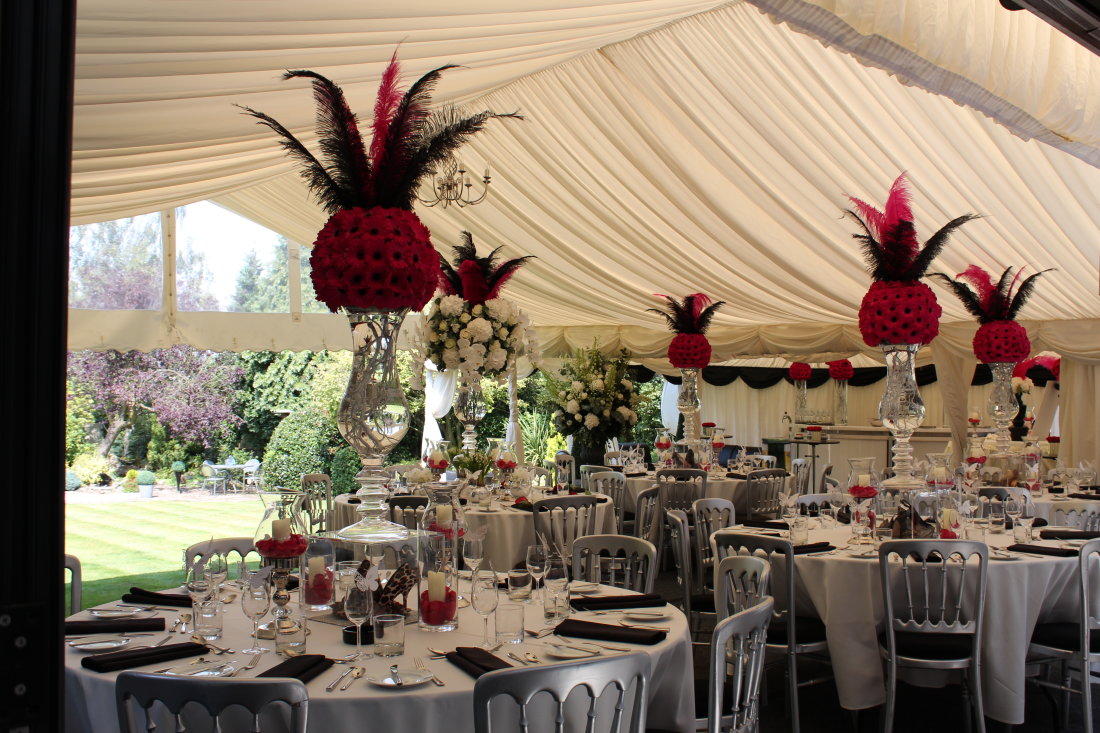 hot-pink-wedding-feathers-marquee-vases-flowers