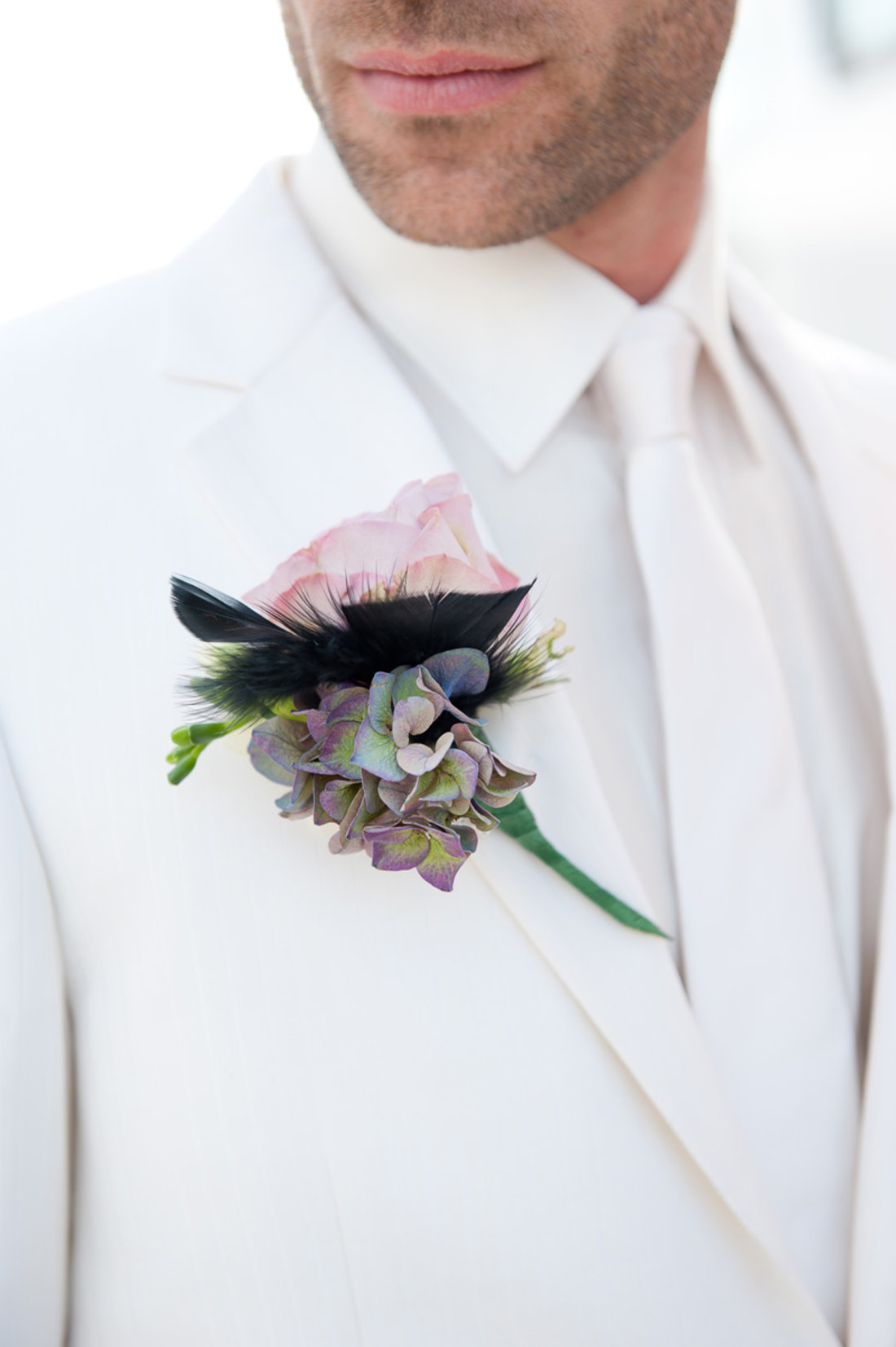 buttonhole-lilac-rose-groom-feather