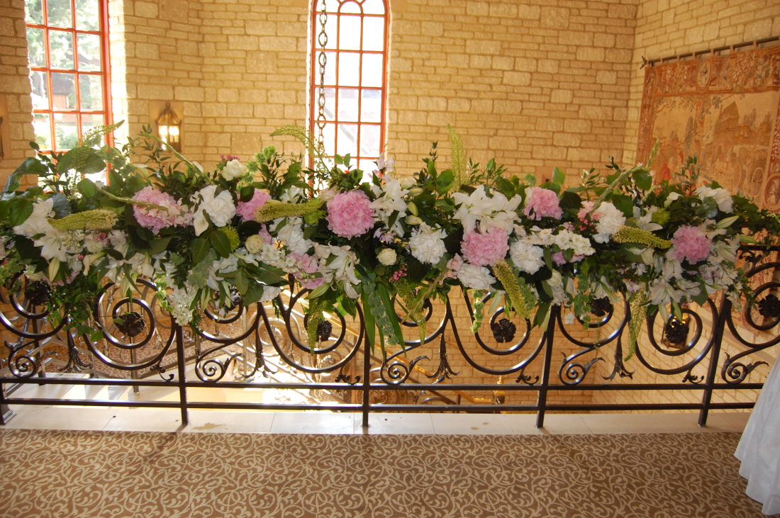 railing-flowers-pinks-greens-white