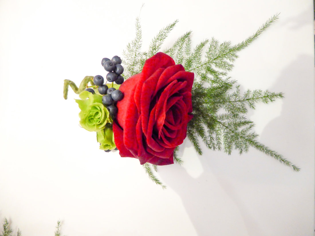 red-rose-fern-buttohole-grrom-wedding-flower