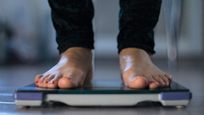 Person stepping on scale