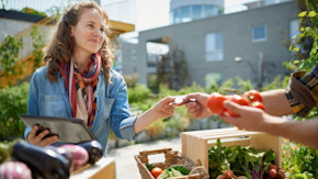 Woman shopping for produce at farmer's market