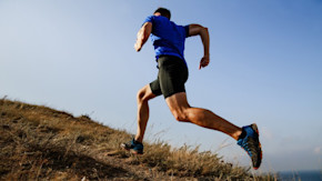Man sprinting up a hill