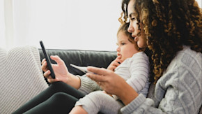 Young mom with toddler on telehealth call