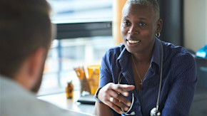 Welcoming-looking doctor with patient