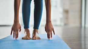 Person in blue tights stretching
