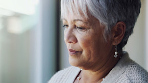Older woman looking sad portraying dementia
