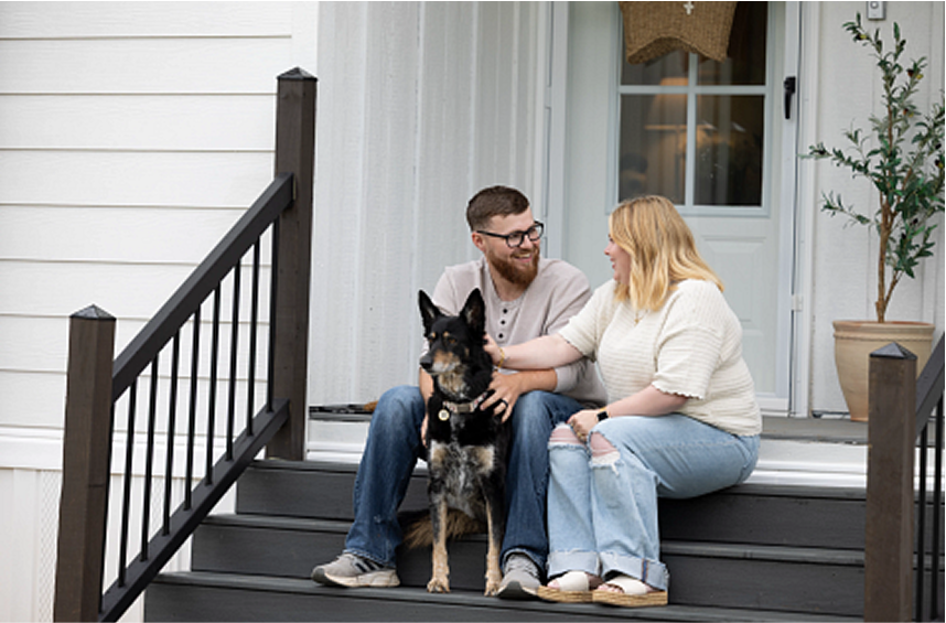 Homeowners on their front porch.