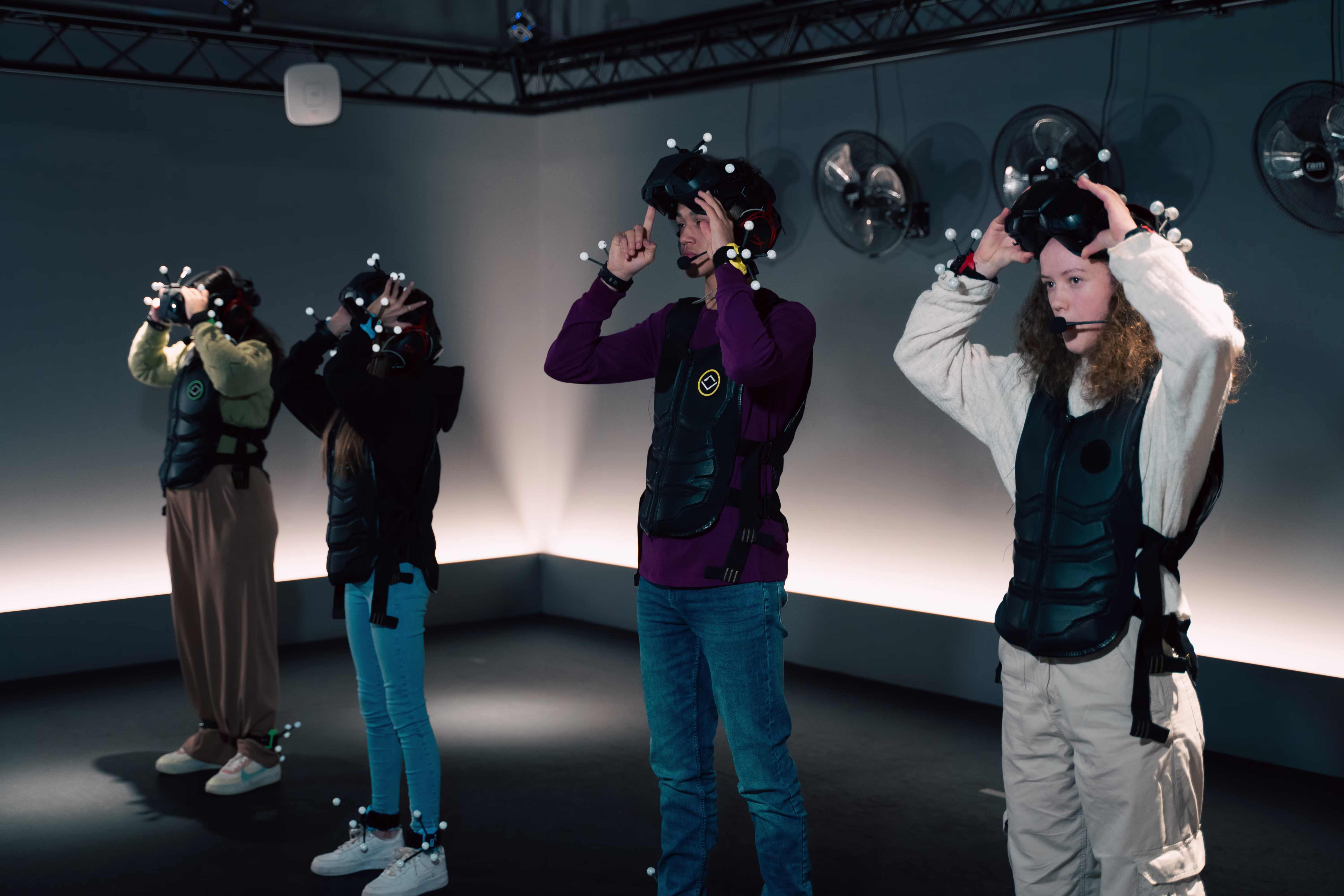 Young Adult Group Suiting Up in VR