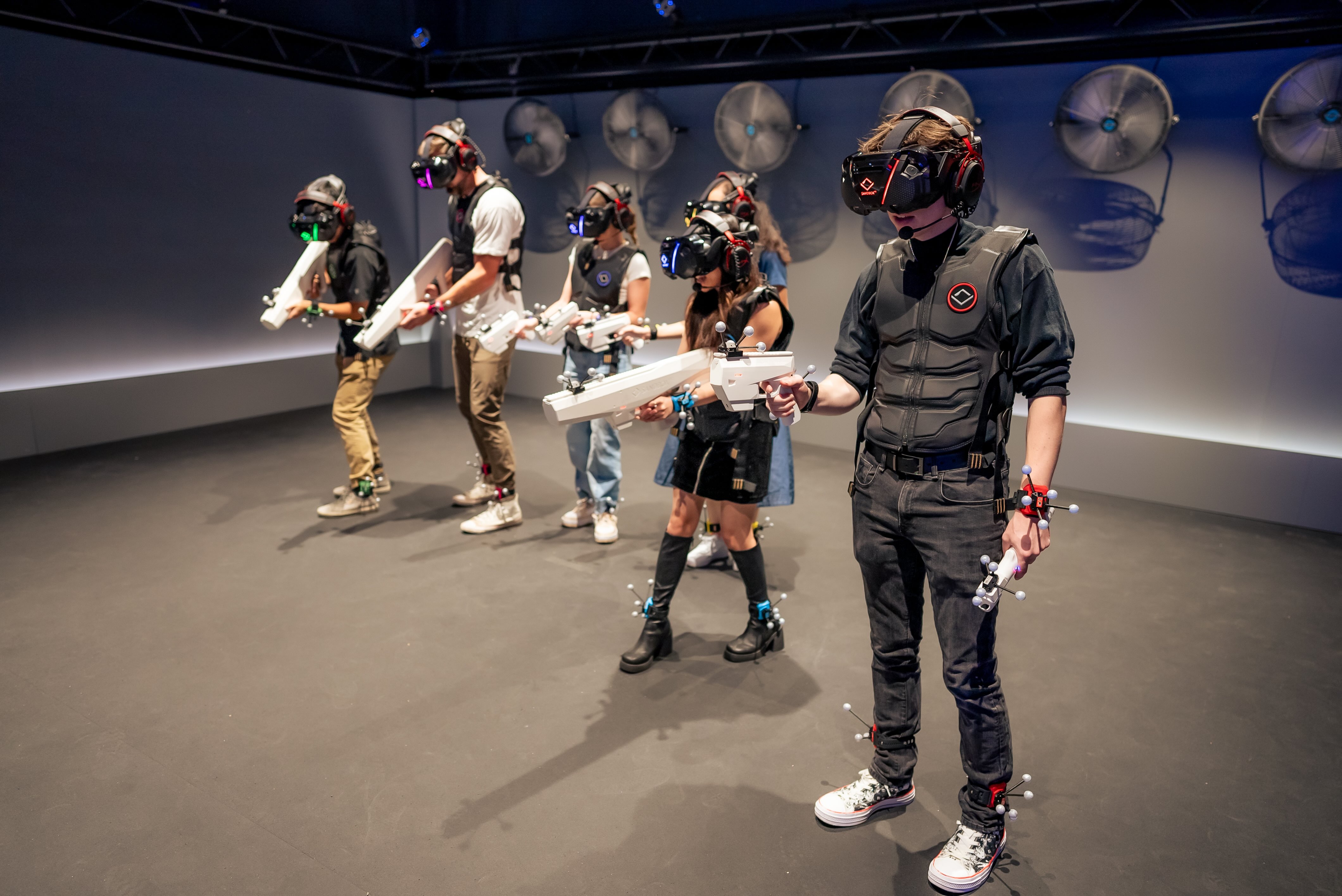 Teenagers playing an immersive VR experience