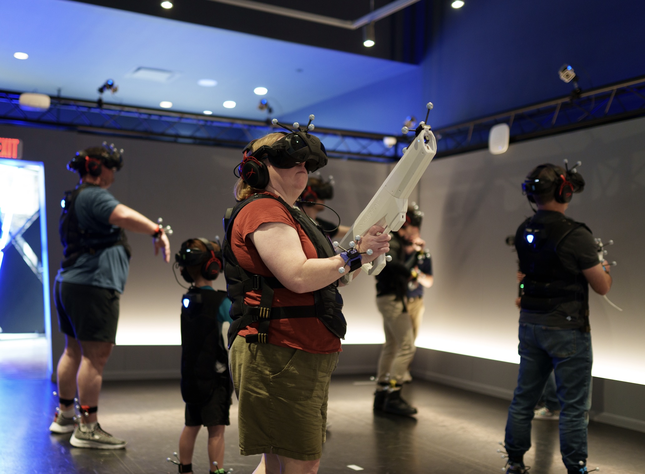 Mom and sons playing a VR experience