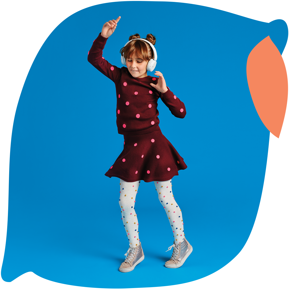 A young girl dancing to music in headphones in the background of an animated image of a lemon