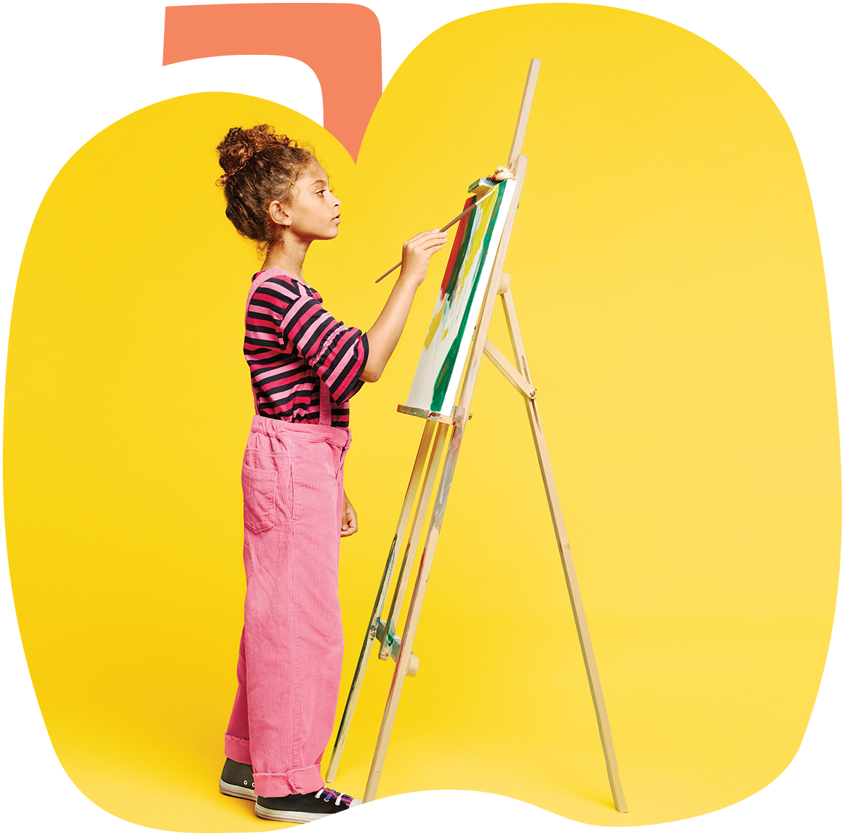 A young girl creating art on an easel in the background of an animated image of an apple