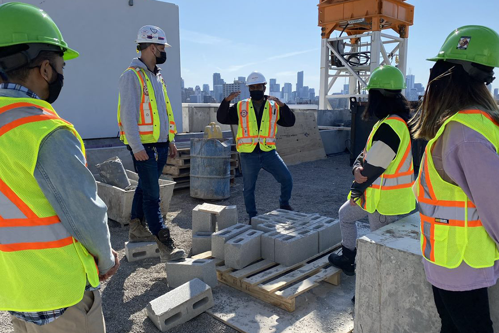 Construction team on rooftop