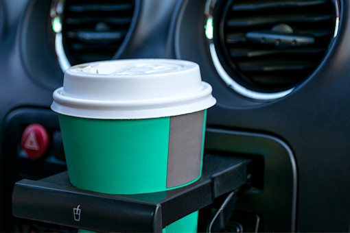 Coffee cup in car cup holder