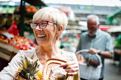 Senior couple shopping in a fruit market