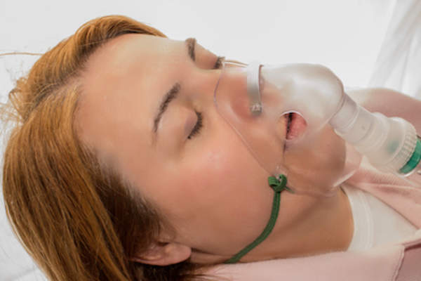 Woman in oxygen mask to battle cyanosis