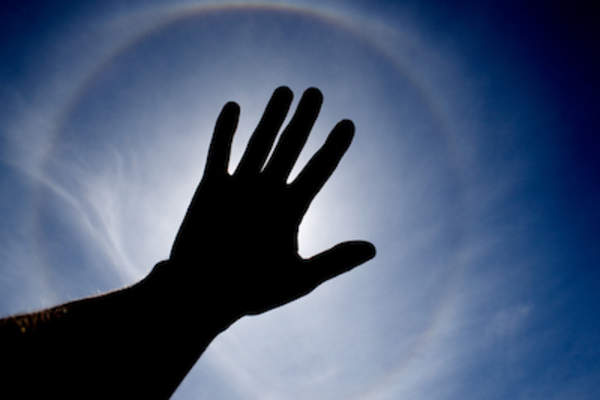 Hand blocking sun