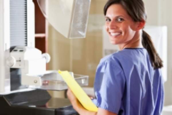 Mammogram machine and technician image.