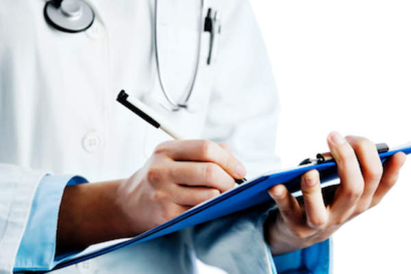 Doctor taking notes.