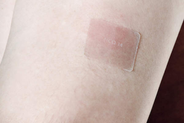 Nicotine patch on arm