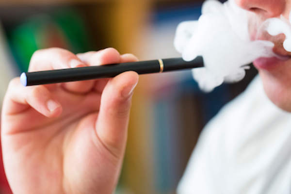 Man smoking e-cigarette