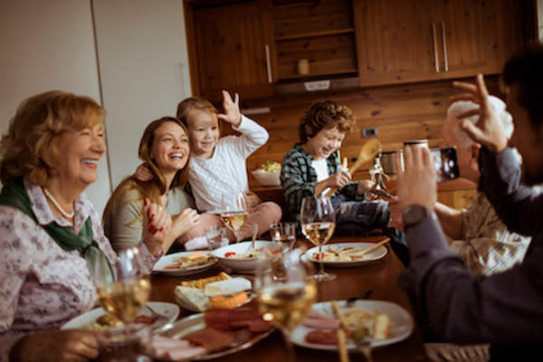 Family really enjoying dinner and each other.