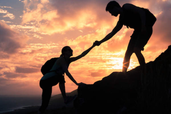 Partnership concept helping up