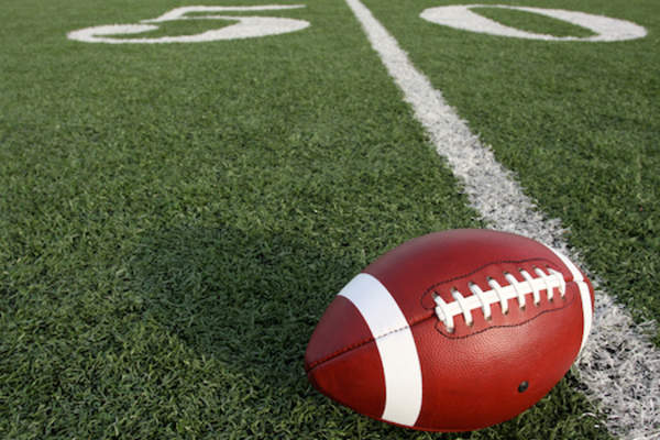 Football on 50 yard line.