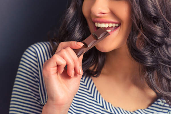 Woman eating chocolate