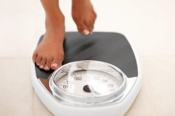 Stepping onto bathroom scale