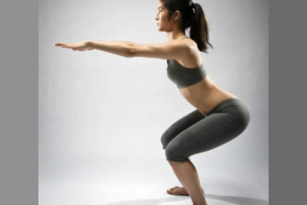 Woman demonstrating squats