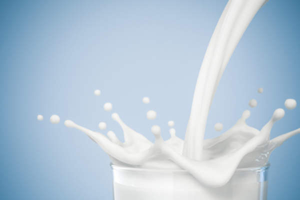 Milk pouring into glass