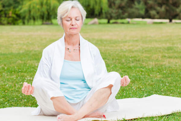 Woman doing low intensity yoga.